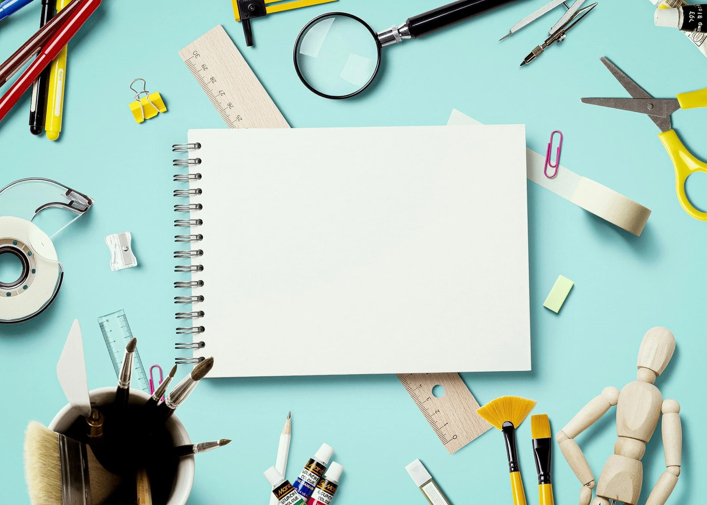 A fresh notebook surrounded by school supplies, ready for a new year